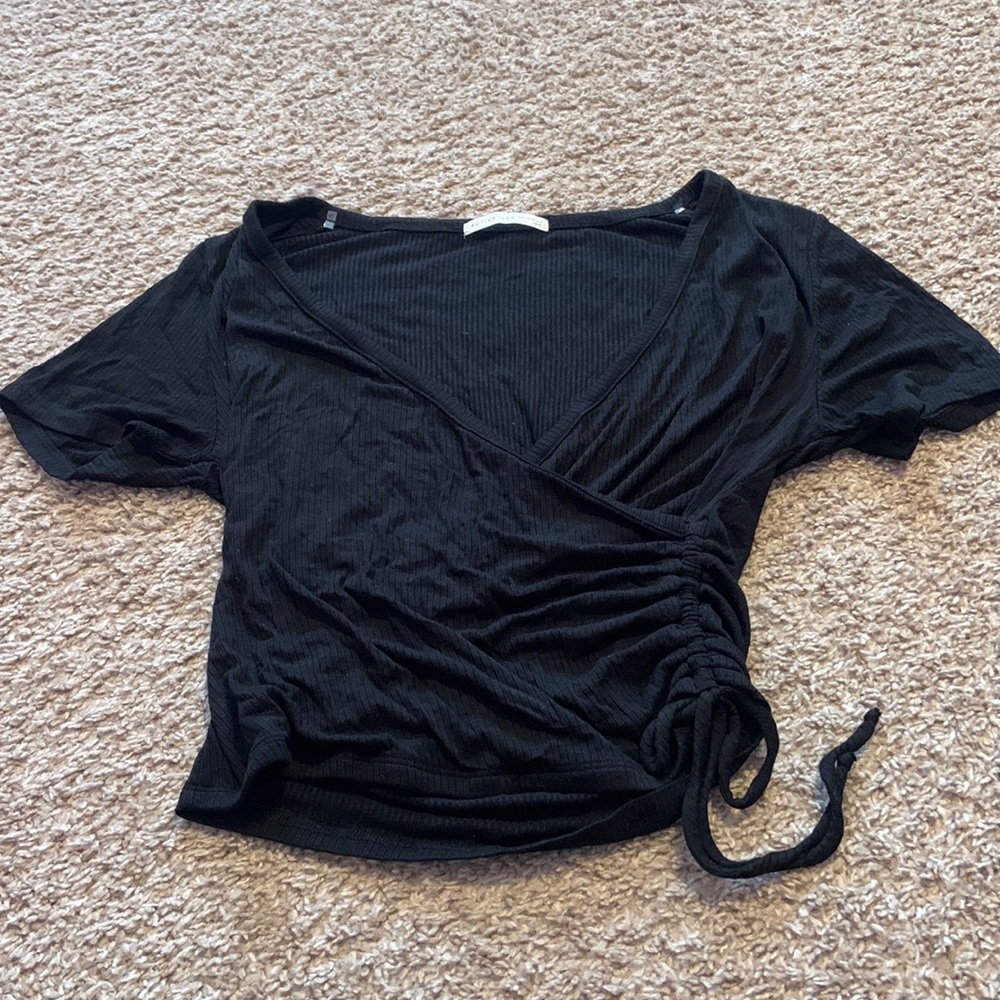 black shirt with tie on the side